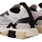 Elegant Monochrome Knit Sneakers with Red Accents