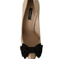 Beige Patent Leather Pumps with Black Bow