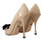 Beige Patent Leather Pumps with Black Bow