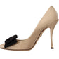Beige Patent Leather Pumps with Black Bow