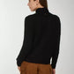 Chic Black Turtleneck with Stud Detailing
