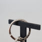 Elegant Black Charm Keychain with Brass Accents