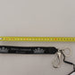 Elegant Black Charm Keychain with Brass Accents