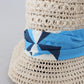 Elegant Beige Bucket Hat with Blue Bow Accent