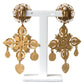 Elegant Gold Tone Madonna Floral Earrings