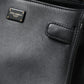 Elegant Black Leather Shoulder Bag with Gold Detailing