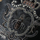 Elegant Black Leather Clutch with Bee Adornments