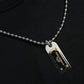 Elegant Black Cotton Crewneck Tee with Dog Tag Detail