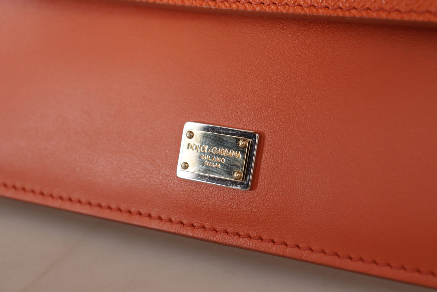 Exquisite Orange Leather Clutch with Gold Accents
