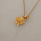 Elegant Gold Tone Clover Charm Necklace